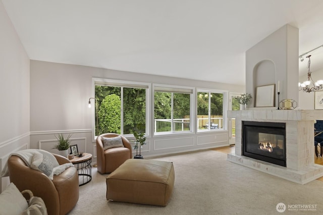 820 173rd Ave NE, Bellevue, WA 98008 - living room with healthy amount of natural light, a glass covered fireplace, carpet floors, and a decorative wall