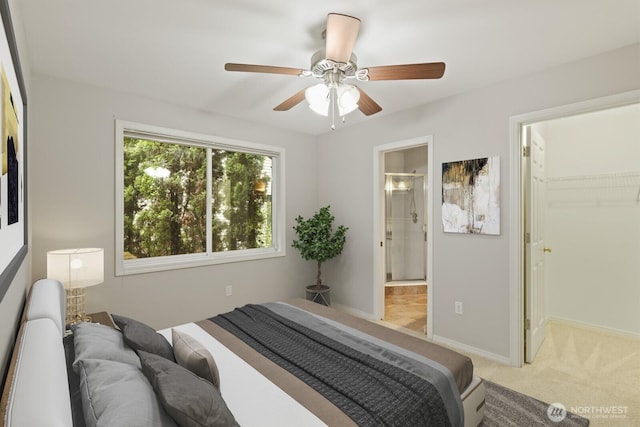 820 173rd Ave NE, Bellevue, WA 98008 - bedroom with light colored carpet, a walk in closet, baseboards, connected bathroom, and ceiling fan