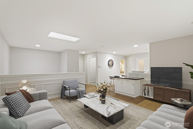 820 173rd Ave NE, Bellevue, WA 98008 - living area with light wood-style floors, a skylight, and recessed lighting