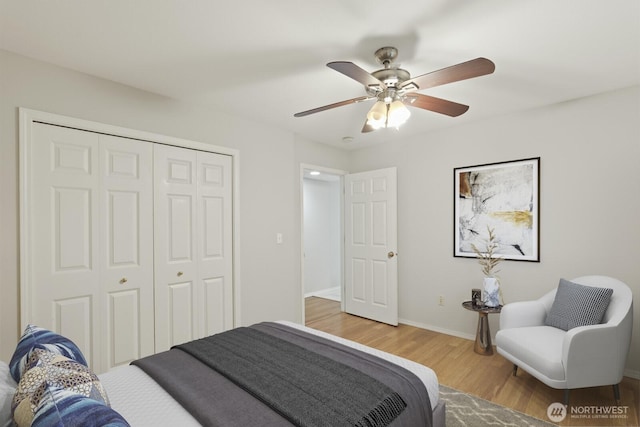 820 173rd Ave NE, Bellevue, WA 98008 - bedroom with wood finished floors, a closet, baseboards, and a ceiling fan
