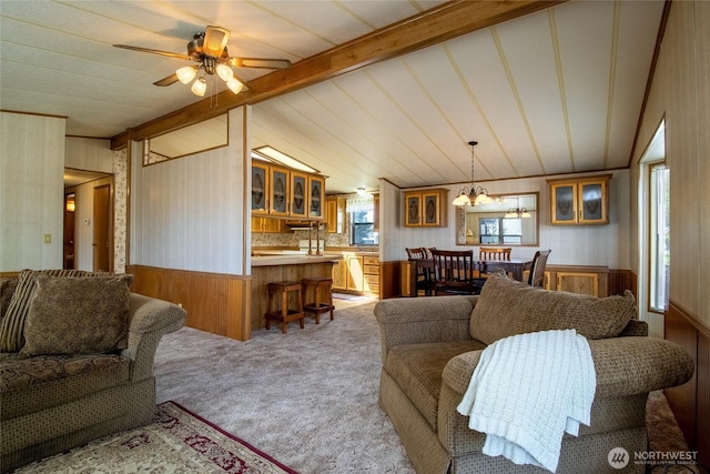 545 NE Troutdale Ave, College Place, WA 99324 - living room featuring wood walls, plenty of natural light, light carpet, a wainscoted wall, and ceiling fan