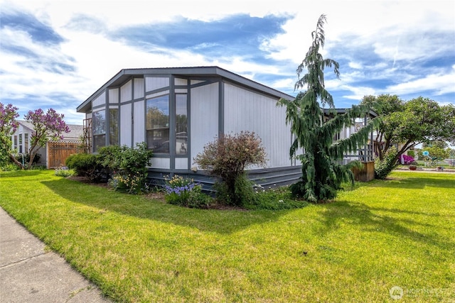 545 NE Troutdale Ave, College Place, WA 99324 - view of property exterior with a yard and a sunroom