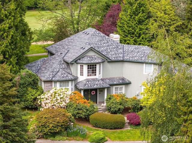 5426 Quail Run, Blaine, WA 98230 - traditional home with a chimney and a shingled roof