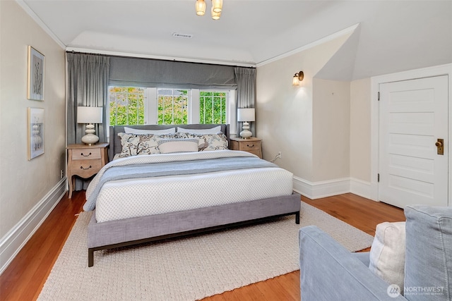 903 W Newell St, Seattle, WA 98119 - bedroom with wood finished floors, baseboards, and crown molding