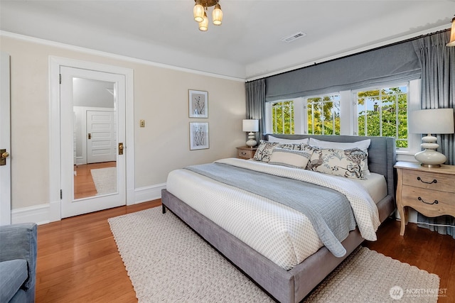 903 W Newell St, Seattle, WA 98119 - bedroom featuring wood finished floors and baseboards