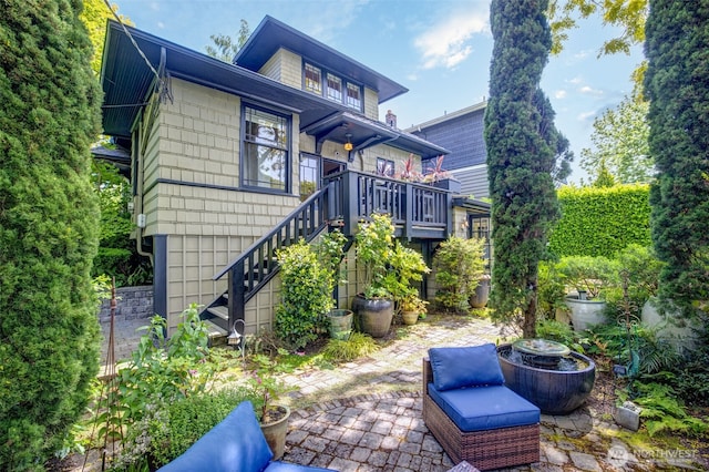 903 W Newell St, Seattle, WA 98119 - back of property with stairway and a patio area