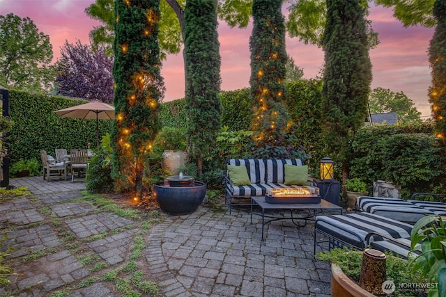 903 W Newell St, Seattle, WA 98119 - patio terrace at dusk with a patio and an outdoor living space with a fire pit