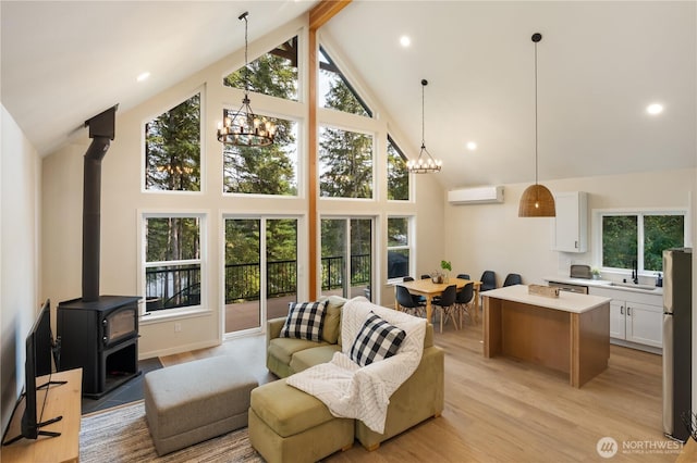 living room featuring high vaulted ceiling, a chandelier, a wood stove, beamed ceiling, and a wall unit AC