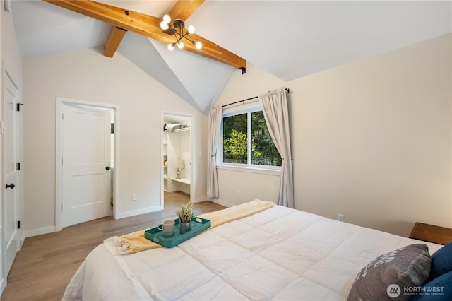 bedroom featuring wood finished floors and baseboards