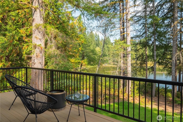 wooden deck with a water view