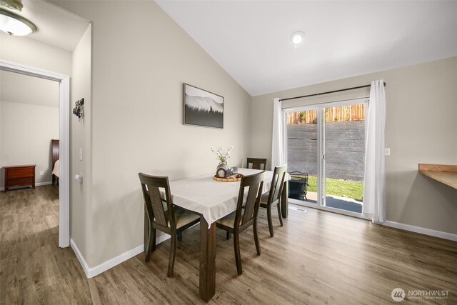 1348 Wheatridge Dr, East Wenatchee, WA 98802 - dining room featuring wood finished floors, lofted ceiling, and baseboards