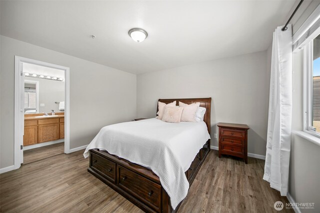 1348 Wheatridge Dr, East Wenatchee, WA 98802 - bedroom featuring light wood-style floors, a sink, baseboards, and multiple windows