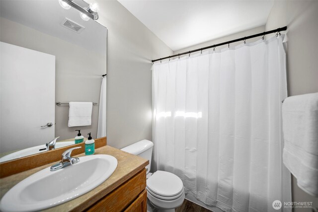 1348 Wheatridge Dr, East Wenatchee, WA 98802 - bathroom with toilet, vanity, and wood finished floors