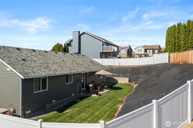 1348 Wheatridge Dr, East Wenatchee, WA 98802 - view of side of property with a patio area, roof with shingles, and a residential view