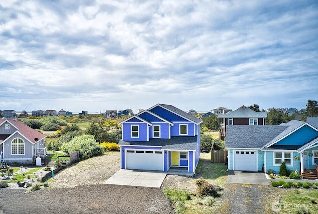 447 S Spinnaker St SW, Ocean Shores, WA 98569 - traditional home with driveway, an attached garage, and a residential view