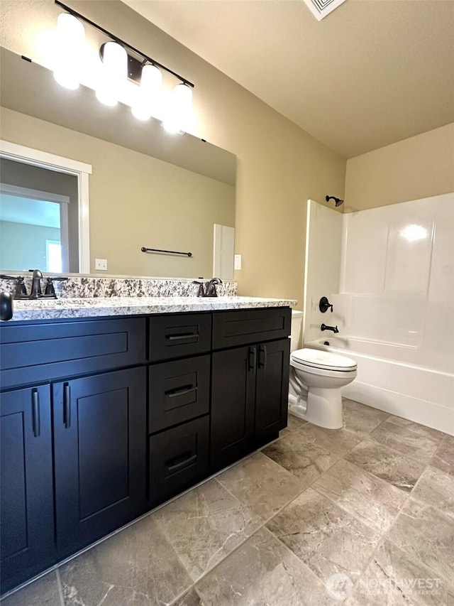 1376 Sand Pebble Ave SW, Ocean Shores, WA 98569 - bathroom featuring double vanity, toilet, and shower / bathtub combination