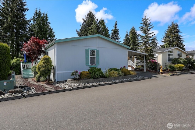 1427 100th St SW Unit 57, Everett, WA 98204 - view of front of house with stairs and a carport
