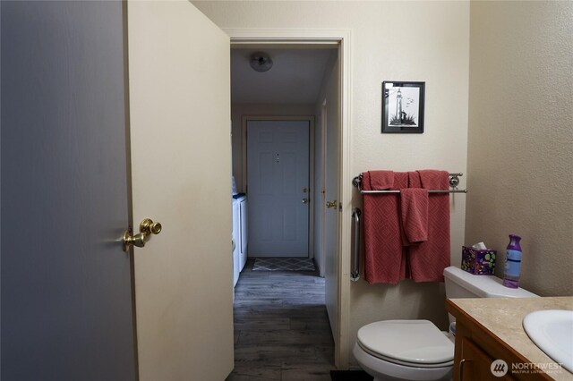 1427 100th St SW Unit 57, Everett, WA 98204 - bathroom featuring vanity, wood finished floors, and toilet