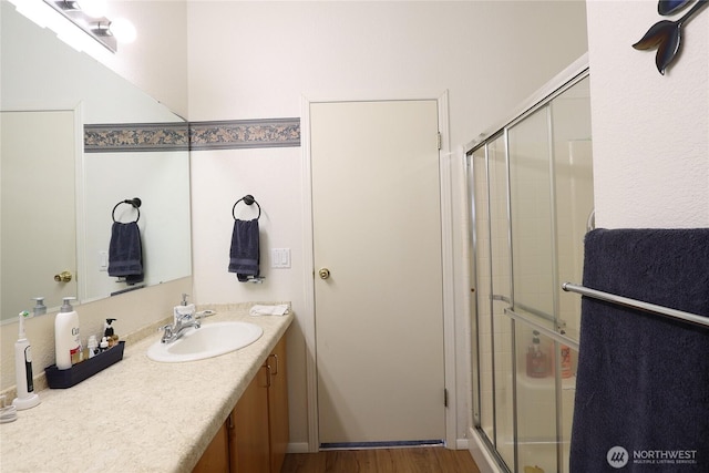 1427 100th St SW Unit 57, Everett, WA 98204 - full bathroom featuring a shower stall, vanity, and wood finished floors