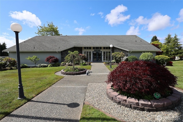 1427 100th St SW Unit 57, Everett, WA 98204 - mid-century inspired home featuring french doors, a front lawn, stone siding, and roof with shingles