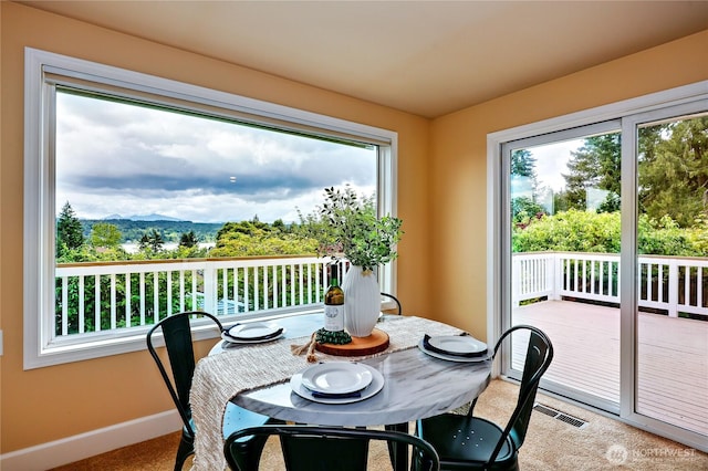 sunroom featuring a mountain view