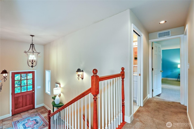 foyer featuring a chandelier, baseboards, and recessed lighting