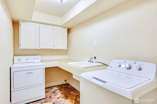 laundry area with cabinet space and washing machine and clothes dryer