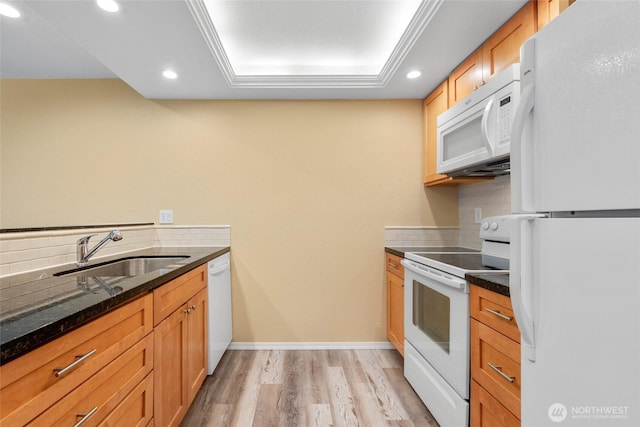 6055 35th Ave SW Unit 207, Seattle, WA 98126 - kitchen with white appliances, a sink, tasteful backsplash, light wood-style floors, and recessed lighting
