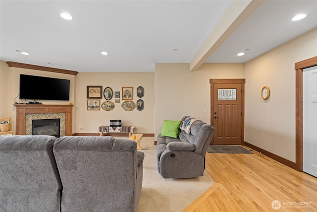 1051 N Baker Unit B104, East Wenatchee, WA 98802 - living area with baseboards, light wood-type flooring, recessed lighting, and a glass covered fireplace