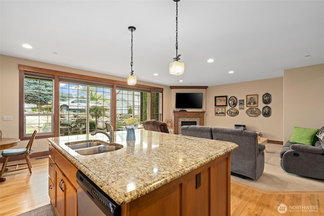 1051 N Baker Unit B104, East Wenatchee, WA 98802 - kitchen featuring dishwasher, a sink, light wood-type flooring, open floor plan, and recessed lighting