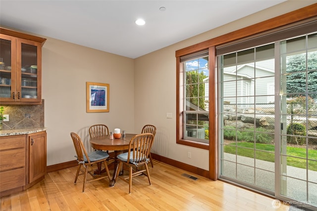 1051 N Baker Unit B104, East Wenatchee, WA 98802 - dining room featuring baseboards, light wood-style floors, and recessed lighting
