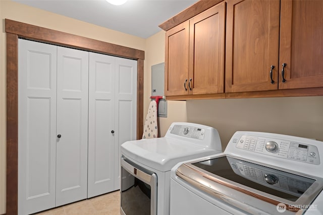 1051 N Baker Unit B104, East Wenatchee, WA 98802 - laundry room with separate washer and dryer, cabinet space, and light tile patterned floors
