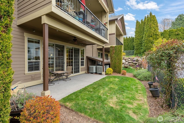 1051 N Baker Unit B104, East Wenatchee, WA 98802 - view of grassy yard with a balcony, a patio, and a ceiling fan