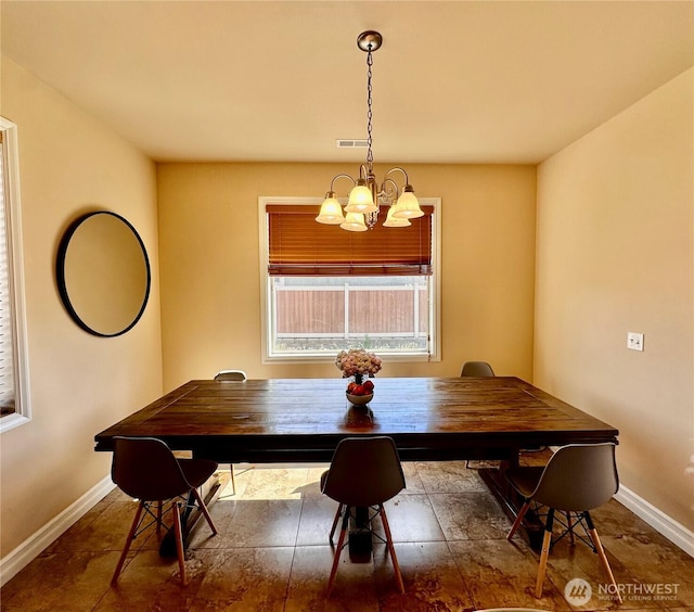 523 N Paxson Dr, Moses Lake, WA 98837 - dining room with a chandelier and baseboards
