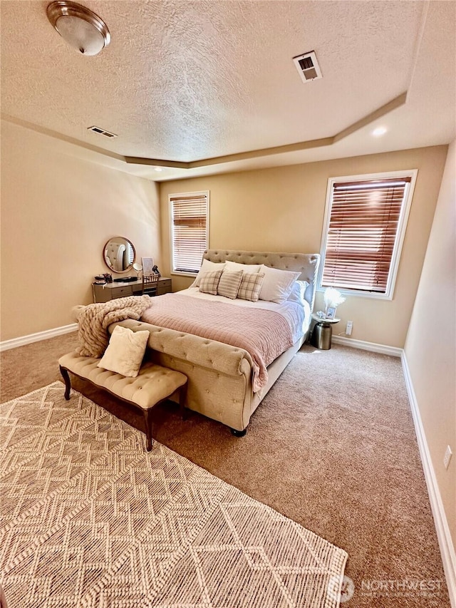 523 N Paxson Dr, Moses Lake, WA 98837 - bedroom featuring carpet floors, a textured ceiling, and baseboards