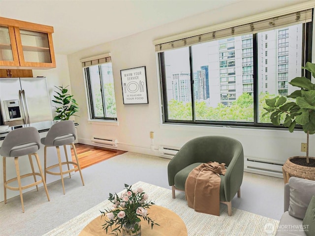 1105 Spring St Unit 904, Seattle, WA 98104 - living area featuring a baseboard radiator and baseboard heating