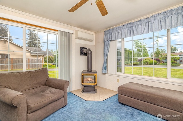 2103 106th St SW, Everett, WA 98204 - living area with a wall mounted AC, a wood stove, a ceiling fan, and carpet flooring