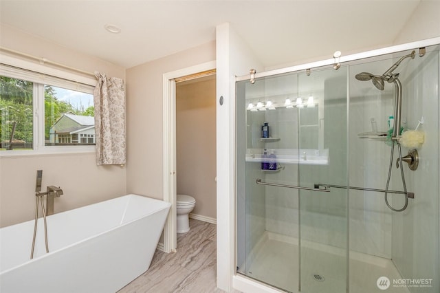 2103 106th St SW, Everett, WA 98204 - full bath with a stall shower, a freestanding tub, toilet, and baseboards