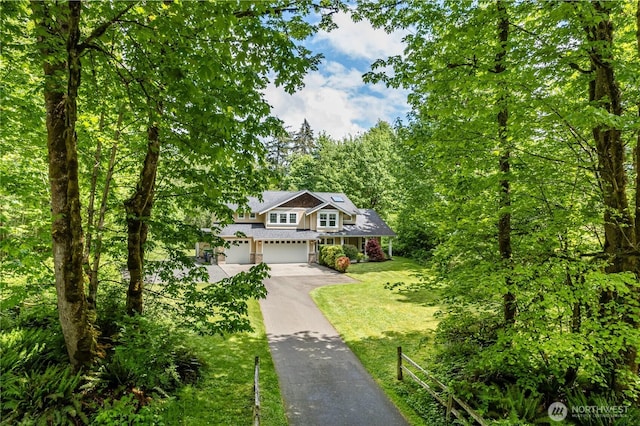 5215 E Lake Bosworth Dr, Snohomish, WA 98290 - view of front of home featuring asphalt driveway, a garage, and a front lawn