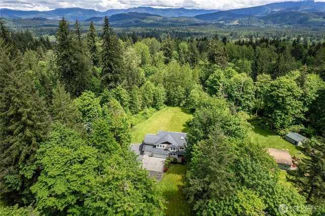 5215 E Lake Bosworth Dr, Snohomish, WA 98290 - aerial view of property and surrounding area with a forest and a mountainous background