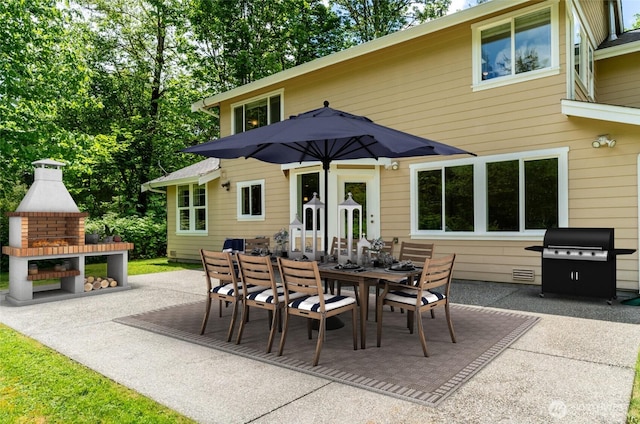 5215 E Lake Bosworth Dr, Snohomish, WA 98290 - view of patio / terrace with a fireplace, grilling area, and outdoor dining space