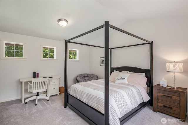 5215 E Lake Bosworth Dr, Snohomish, WA 98290 - bedroom featuring light carpet, multiple windows, vaulted ceiling, and baseboards