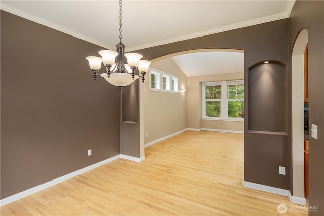 5215 E Lake Bosworth Dr, Snohomish, WA 98290 - spare room featuring arched walkways, light wood finished floors, a chandelier, baseboards, and vaulted ceiling
