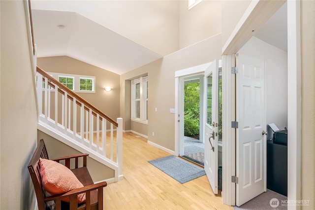 5215 E Lake Bosworth Dr, Snohomish, WA 98290 - entryway with light wood-style floors, stairway, lofted ceiling, and baseboards