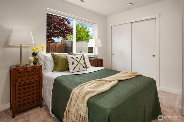 4321 S Webster St # E, Seattle, WA 98118 - carpeted bedroom with a closet and baseboards