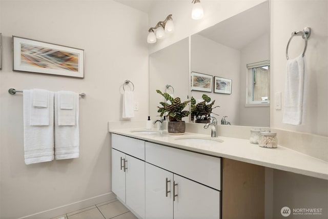 4321 S Webster St # E, Seattle, WA 98118 - full bath with tile patterned flooring, double vanity, and baseboards