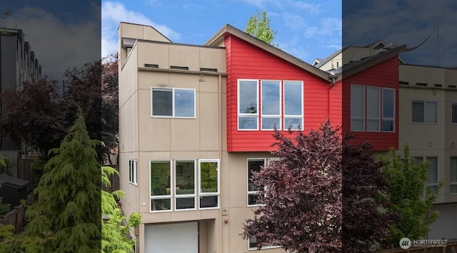 4321 S Webster St # E, Seattle, WA 98118 - rear view of property featuring a garage and stucco siding
