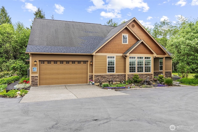 108 Reynolds Rd, Castle Rock, WA 98611 - craftsman-style house featuring stone siding, asphalt driveway, and a garage