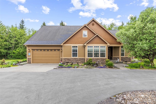 108 Reynolds Rd, Castle Rock, WA 98611 - craftsman house featuring stone siding, driveway, and a garage