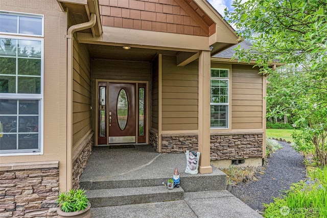 108 Reynolds Rd, Castle Rock, WA 98611 - doorway to property featuring stone siding